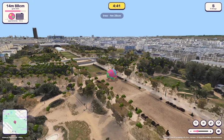 An aerial view of the Champ de Mars and the Paris skyline with a fifteen metre ball on the lawn, the gauge comparing it to an apartment block